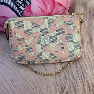 LV Pouchette Tahittiene Mini wristlet.